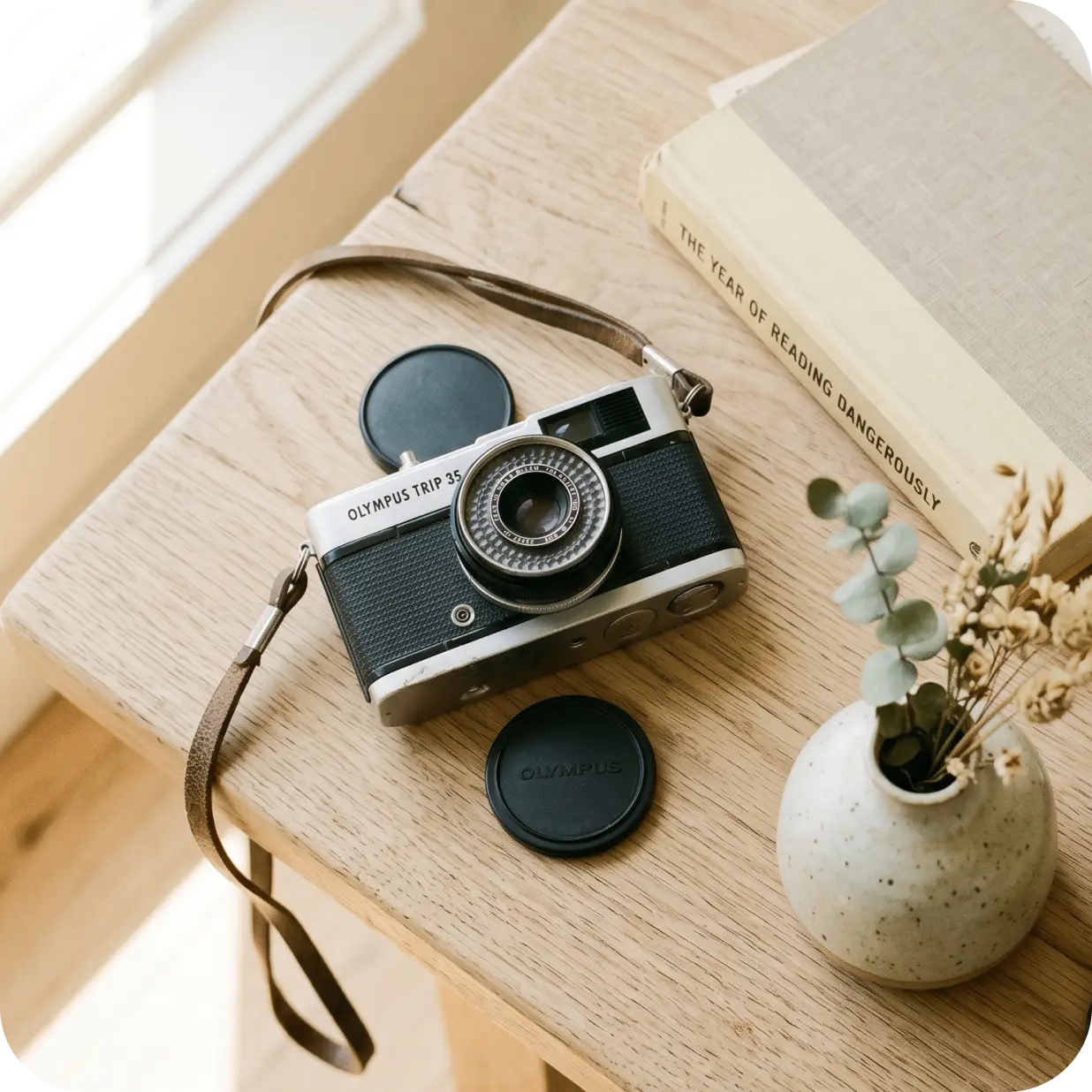 A vintage camera on a desk, ready to be listed for sale